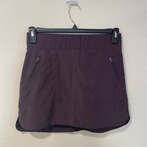 Tennis or golf skirt with built in shorts and zipper front pockets  Size S
